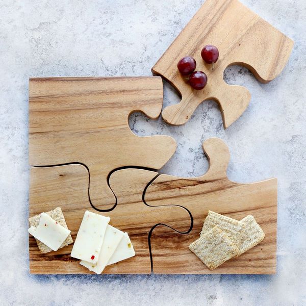 wooden kitchen board with cheese and crackers