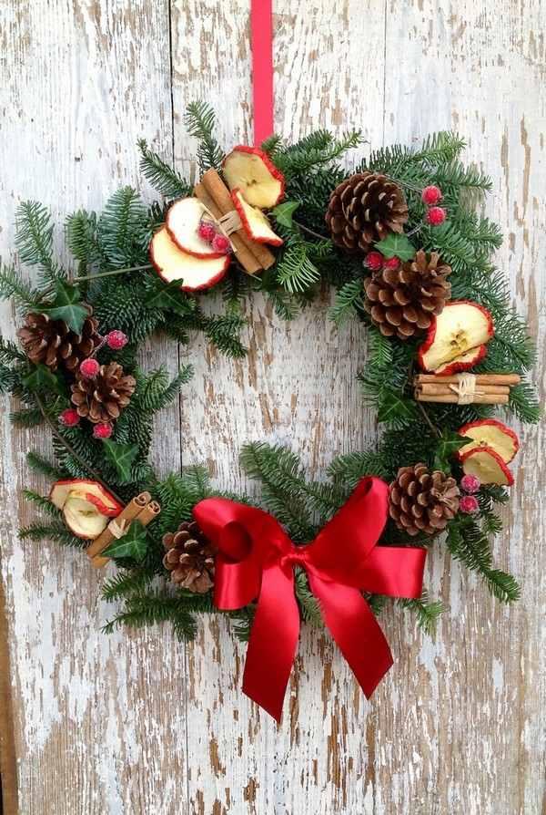 Christmas wreath fir branches cones cinnamon sticks dried apples