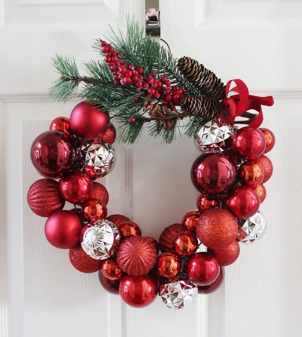 Christmas wreath on front door red and silver tree ornaments