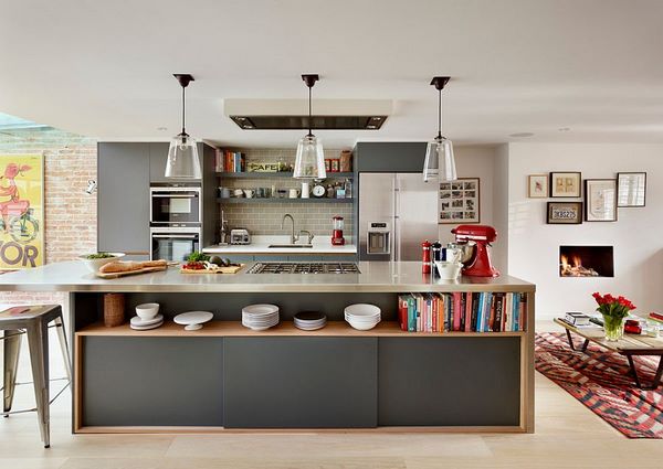 gray island with open shelving and stainless steel countertop