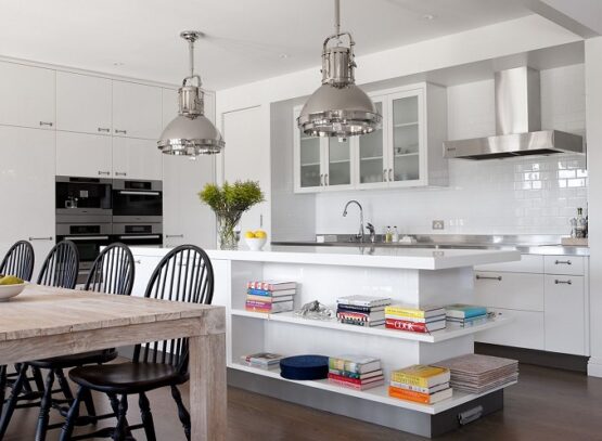 white-kitchen-island-with-open-shelves-wood-dining-table-and-black-chairs