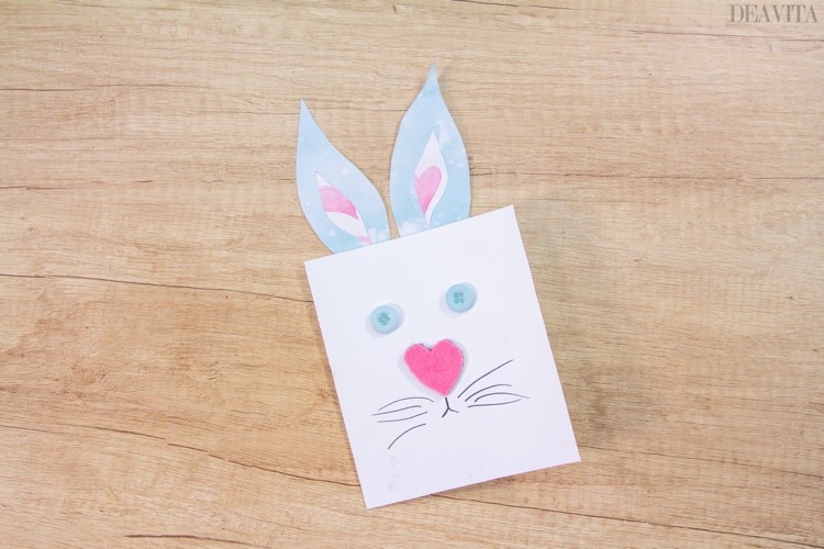 Easter card with cute bunny ears made of designer paper