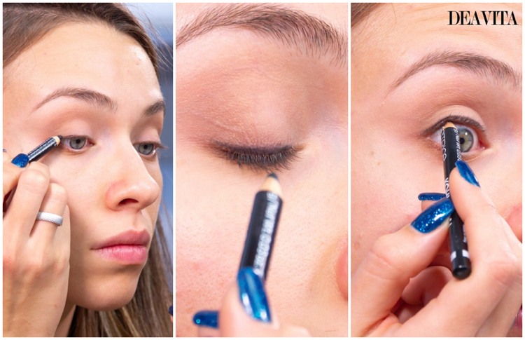 drawing a line along the upper eyelash with black eye pencil