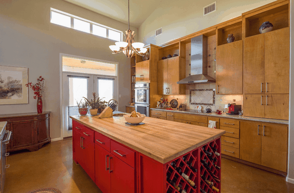 kitchen island contrast color wine storage and cabinets
