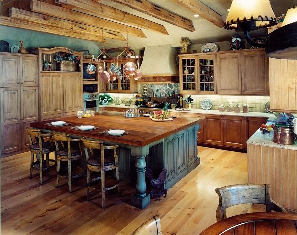 rustic kitchen with exposed ceiling beams island with seating and hanging pots and pans rack 