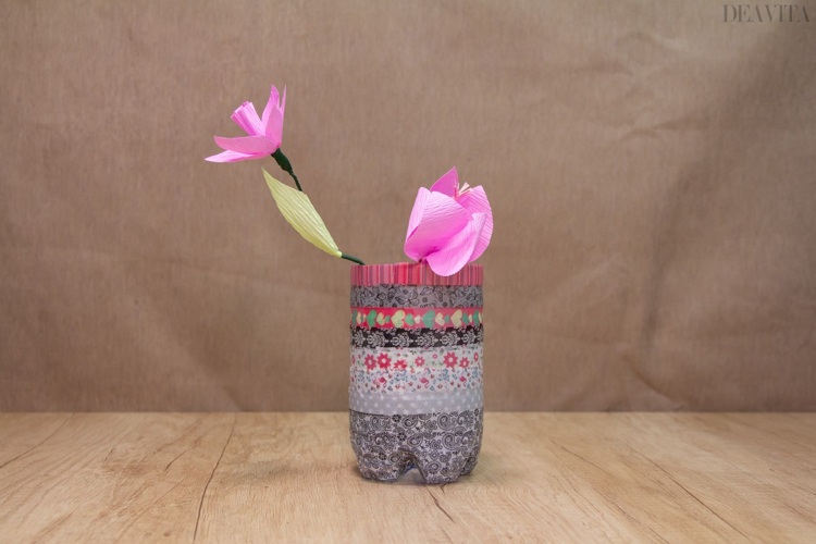 vase from water bottle decorated with Washi tape