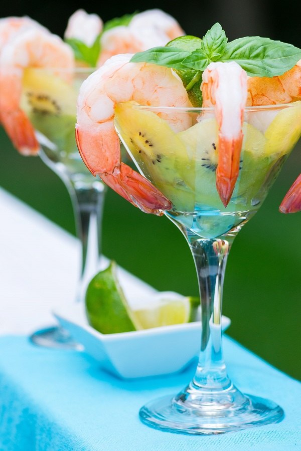 elegant appetizers in martini glass Kiwi and shrimp cocktail 