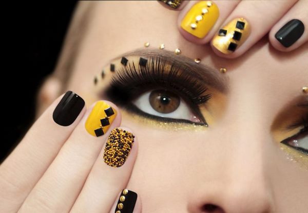gold yellow and black nail art festive manicure