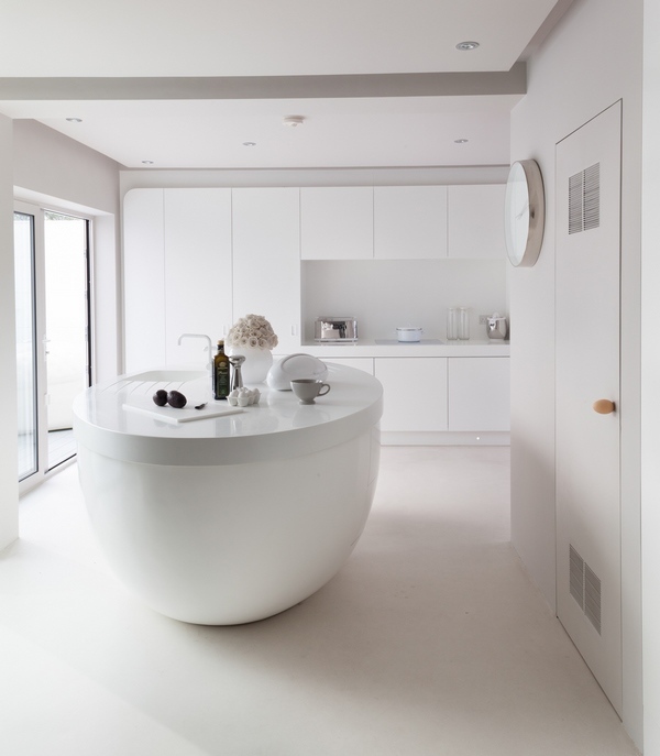 minimalist white kitchen design with oval island