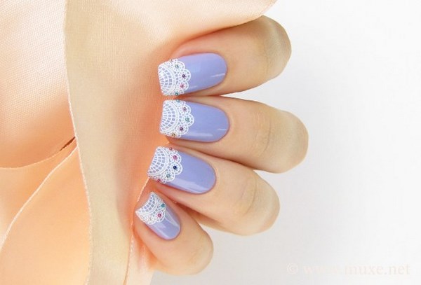 french manicure in pastel colors with lace and beads decoration