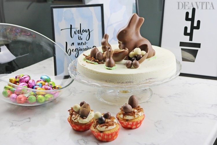festive chocolate cake with chocolate bunny and cupcakes with chocolate eggs