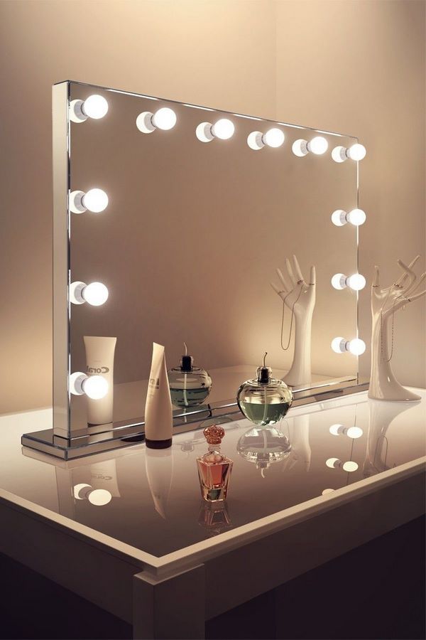 small round makeup mirror on a stand with built in lighting