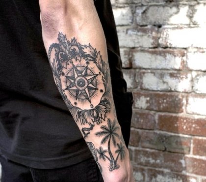 Compass-and-palm-trees-tattoo-on-forearm