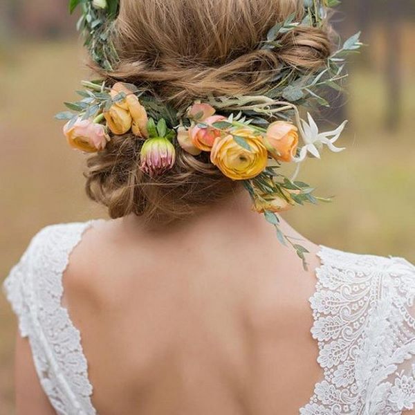boho chic bride hairstyles low bun with flowers
