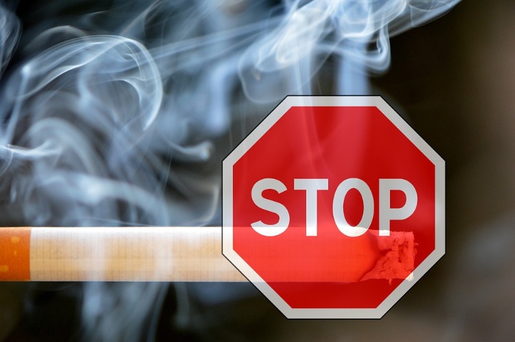 cigarette smoke and stop sign signal to quit smoking
