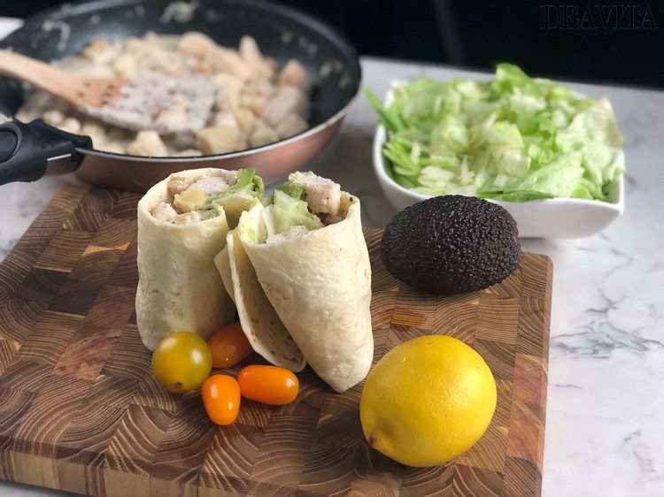 coconut chicken wrap with filling and iceberg salad