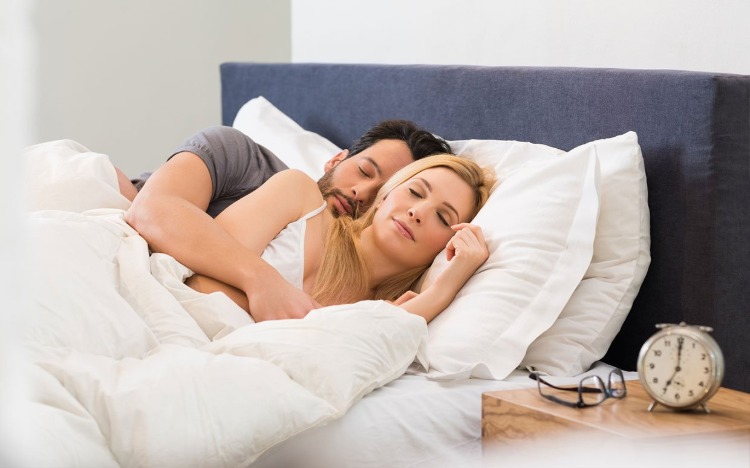 man and woman sleeping together