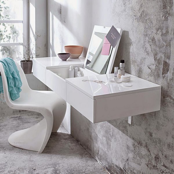 suspended vanity table with folding mirror and modern chair