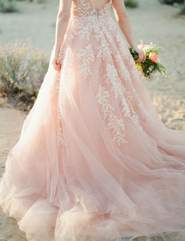 Wedding dress in pink with white embroidery for a subtle contrast