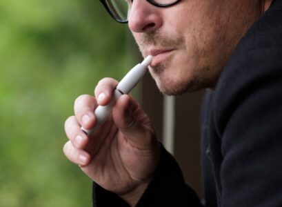 a-man-smoking-hybrid-cigarette