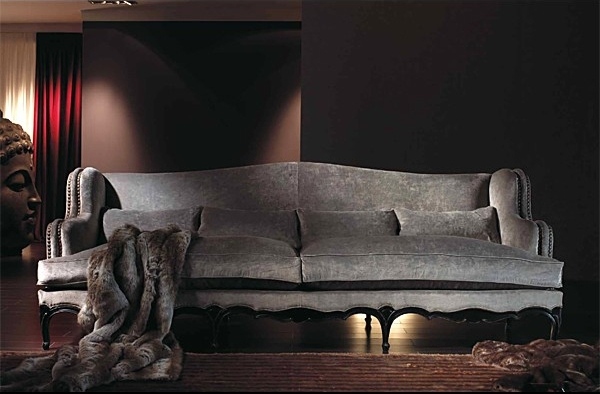 an amazing gray sofa with elegant design and beautiful curved lines