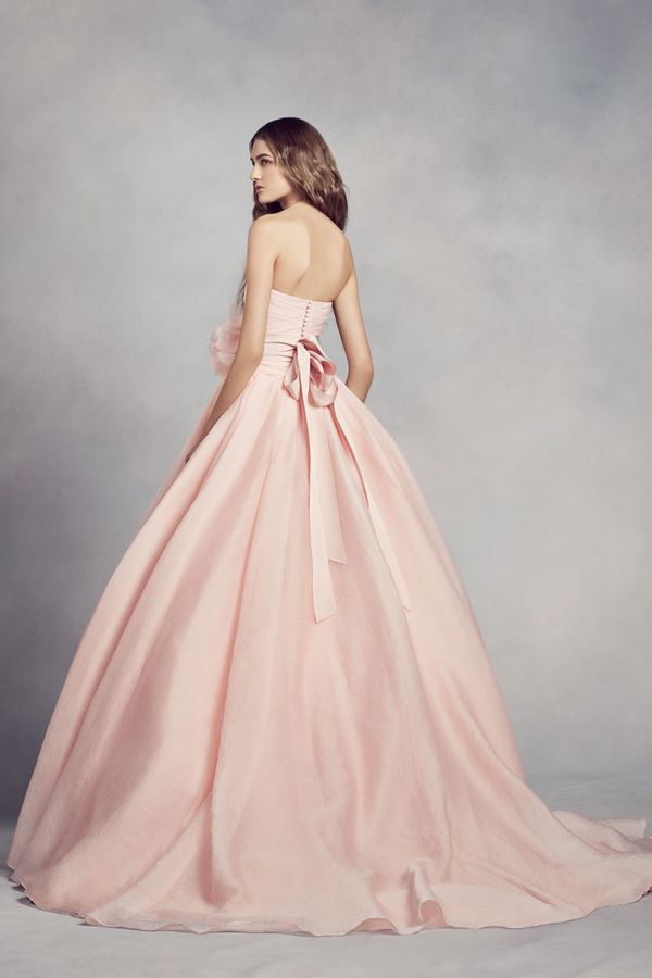 exceptional wedding dress in blush pink with bow on the waist