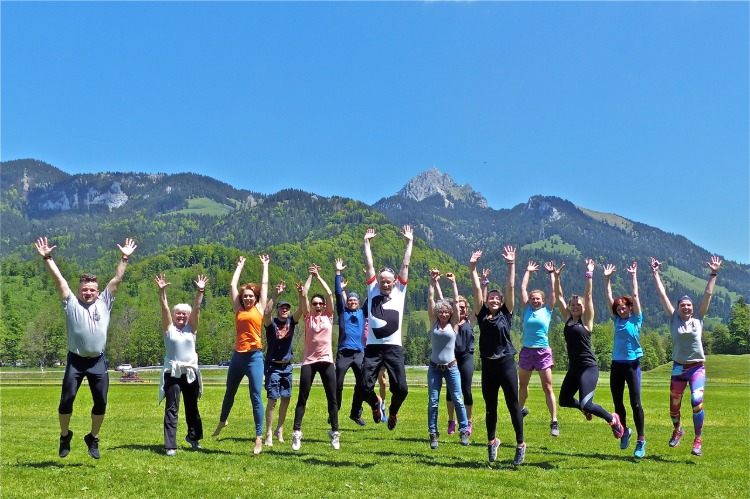 outdoor activities and sports people in group breathing fresh air in the mountains