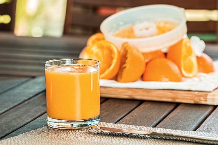 squeezed orange juice in glass containing much vitamin c