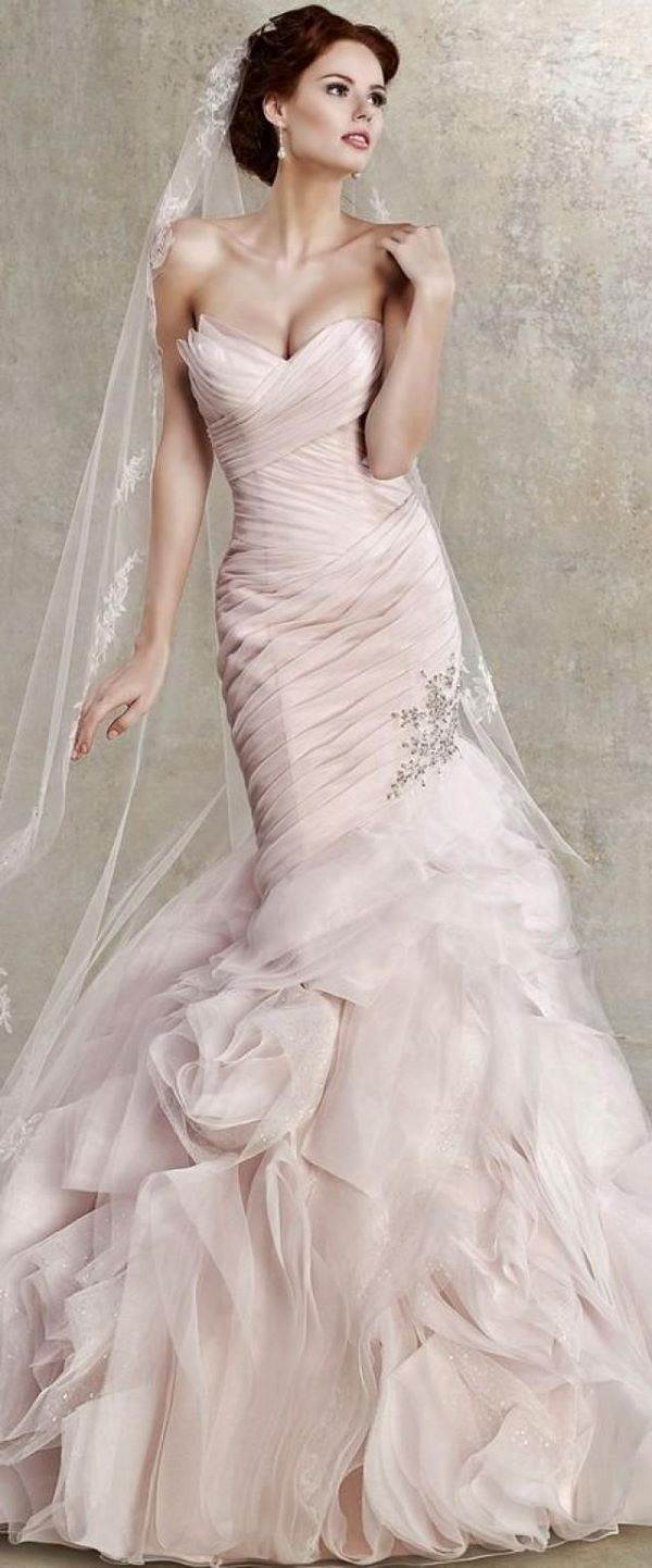 mermaid wedding dress in blush pink color with beautiful ruffles