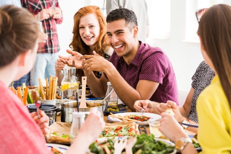 young people at the table with vegetarian food