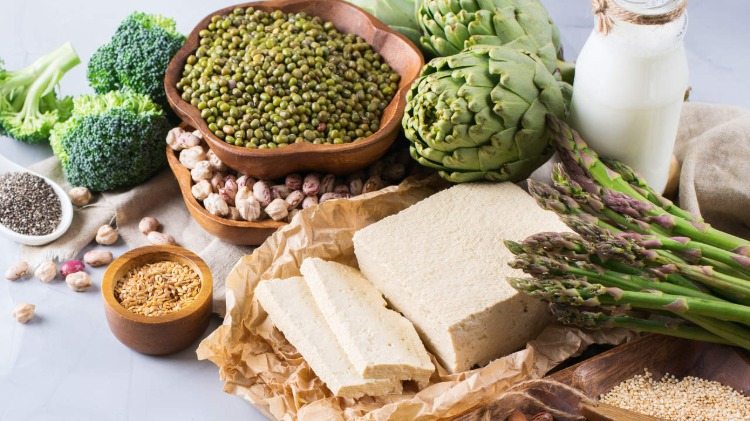 soybean asparagus tofu and other food on a table for a vegetarian diet