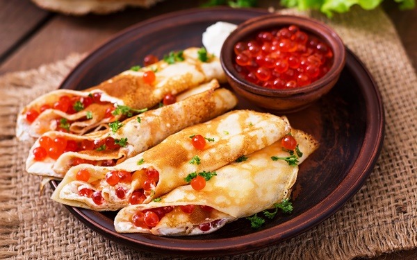 traditional crepes stuffed with red caviar 