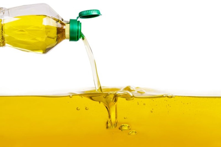 unhealthy vegetable oil from plastic bottle with saturated fatty acids
