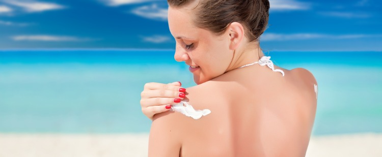woman exposed to solar radiation uses sunscreen