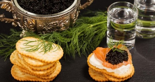 bowl of caviar crackers and vodka