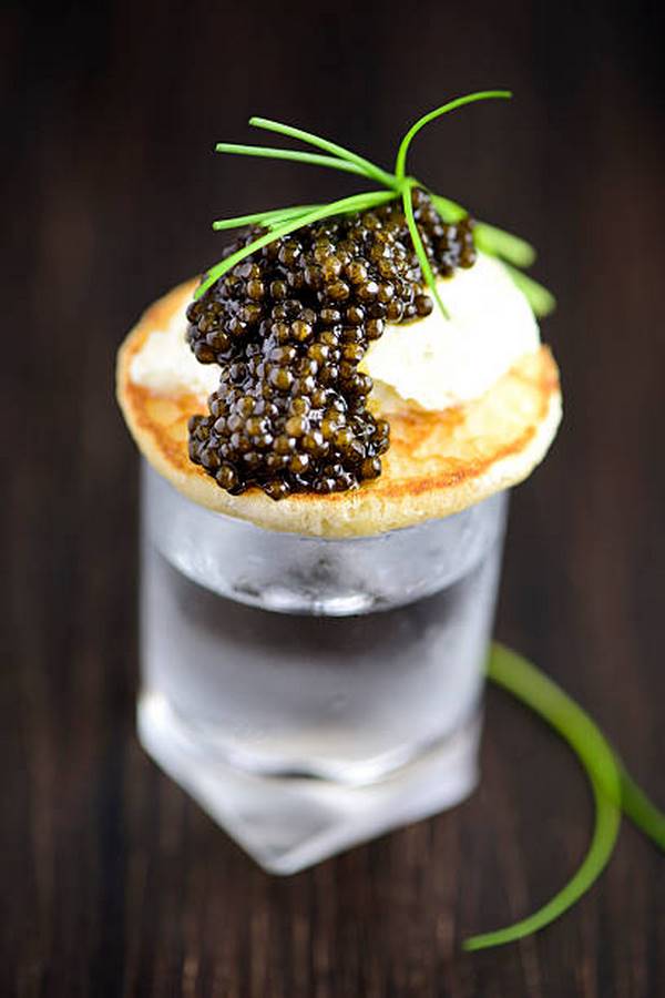 classic vodka and pancakes with sour cream and caviar