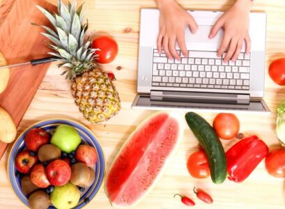 eating-in-summer-pineapple-watermelon-and-other-fruits-and-vegetables-while-working-on-laptop