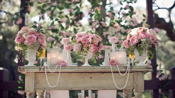 flowers beads and candles on vintage table wedding decor ideas