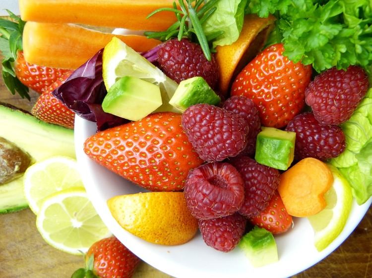 healthy fruits and vegetables avocado and carrot strawberries and raspberry