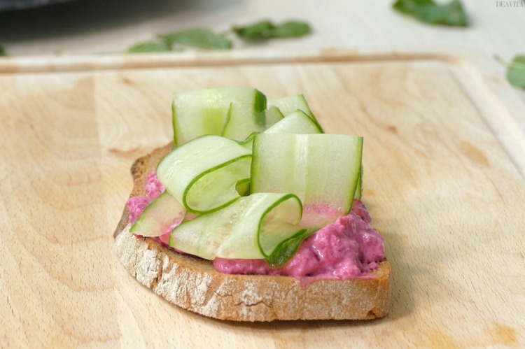 light vegetarian breakfast slice of bread with beetroot spread and cucumber