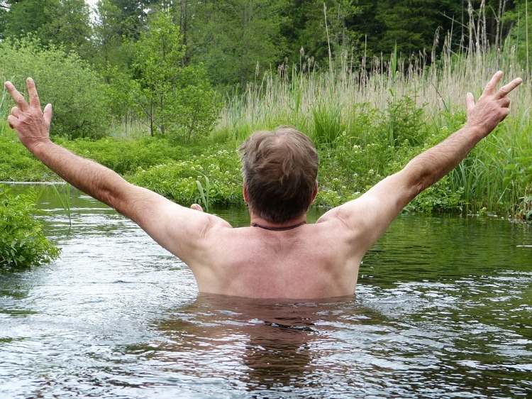 man bathing in river good health and strong immunity