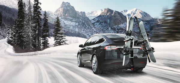 Tesla crossover mountain landscape and ski