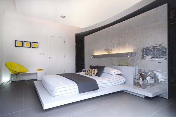 modern bedroom with platform bed and accent wall