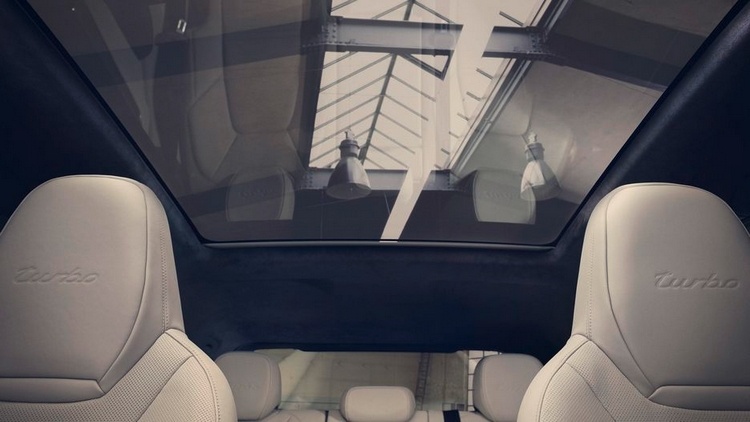 panoramic glass roof and white leather seats the interior of porsche cayenne coupe