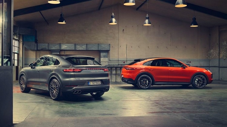 porsche cayenne coupe in orange gray view from behind the back to exhaust system