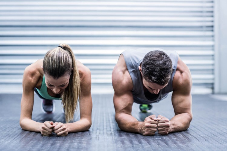 man and woman in cardio training
