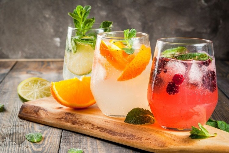 summer cocktails without alcohol with fruits and spring water mint leaves 