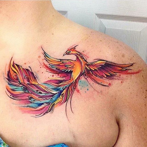 watercolor phoenix tattoo on clavicle