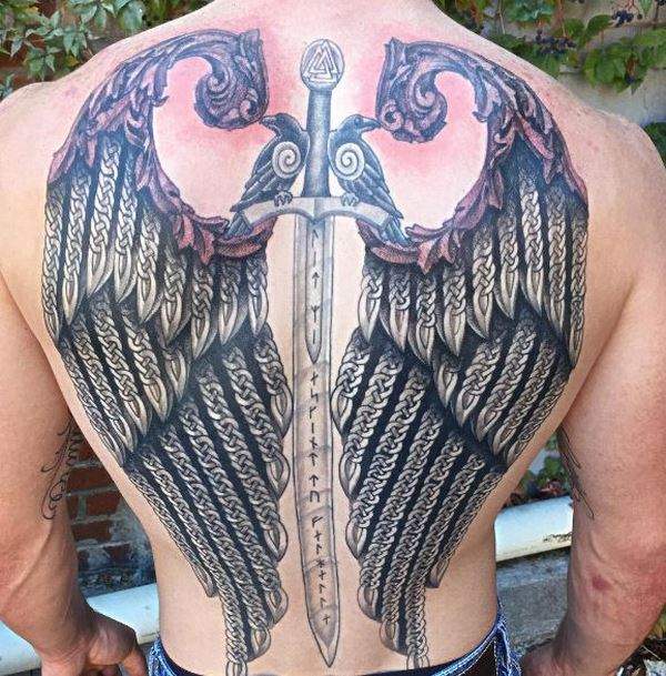 Celtic style wings and sword tattoo on back