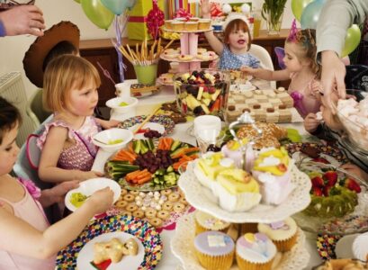 kids-birthday-party-with-full-table-of-delicious-treats
